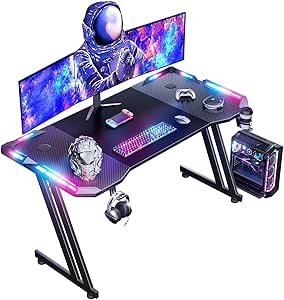 HLONONE 120 × 60cm LED Mesa Gaming, Escritorio Gaming de Fibra de Carbono Ergonómicas, Escritorio Gamer con Portavasos y Gancho para Auriculares, Negro